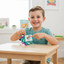 Child using Communication Keyring with visual symbol cards